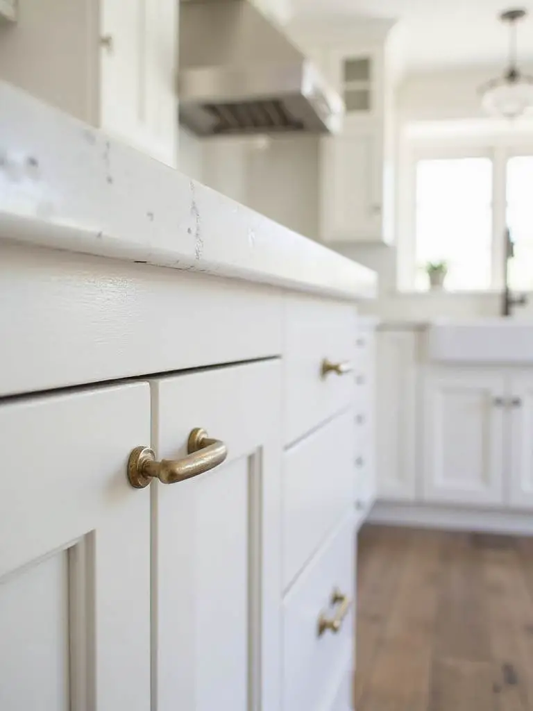 Coastal kitchen with brushed nickel and brass cabinet hardware