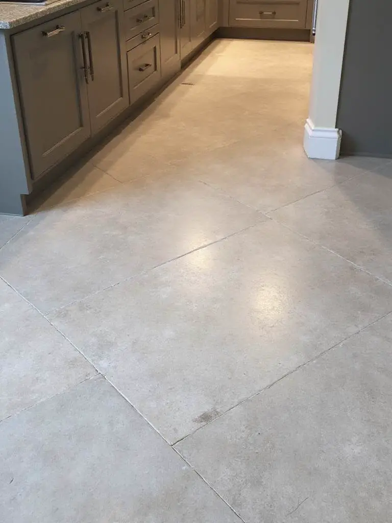 Modern kitchen with large format porcelain tiles enhancing visual spaciousness